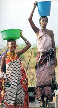 Picture of African women carrying water on their heads, relaxed and upright